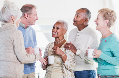 Five senior citizens informally talking to each other