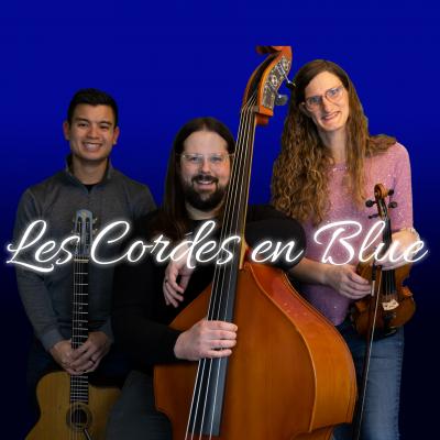 A picture of the trio Les Cordes en Blue. One member holds a guitar, another has a stand-up bass, and the third has a violin.