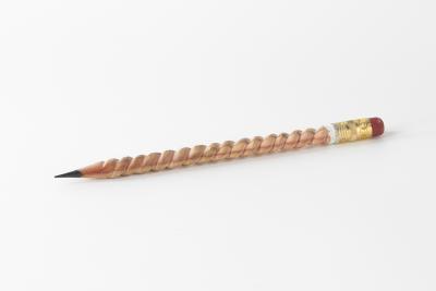 Image of a pencil with the wood carved into a spiral shape. 