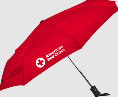 A red umbrella with the American Red Cross name and logo