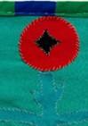 A small flower embroidered onto clothing
