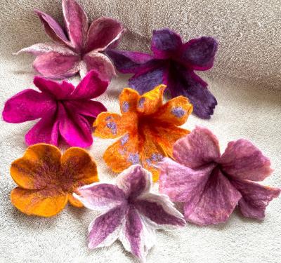 Felted flowers of purple, pinks and yellow hues