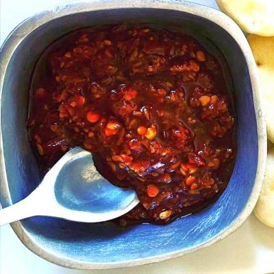 A small bowl with the North African chili paste, harissa.
